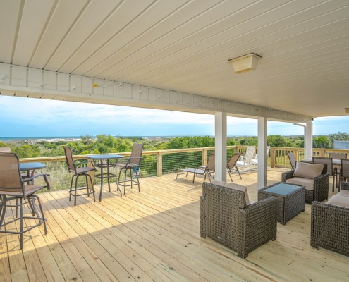Huge oceanfront deck with multiple seating areas